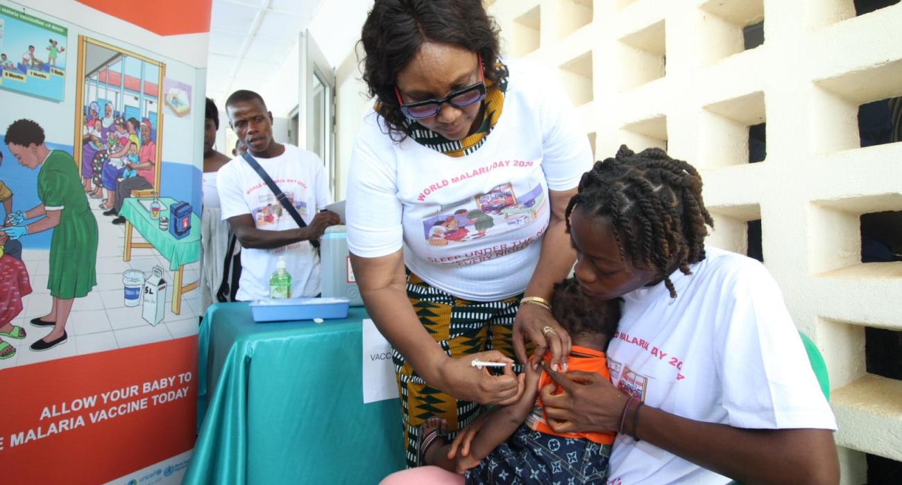 Health Minister Dr. Louise Kpoto administers the first dose Malaria Vaccine during the launch of Malaria Vaccine in Liberia