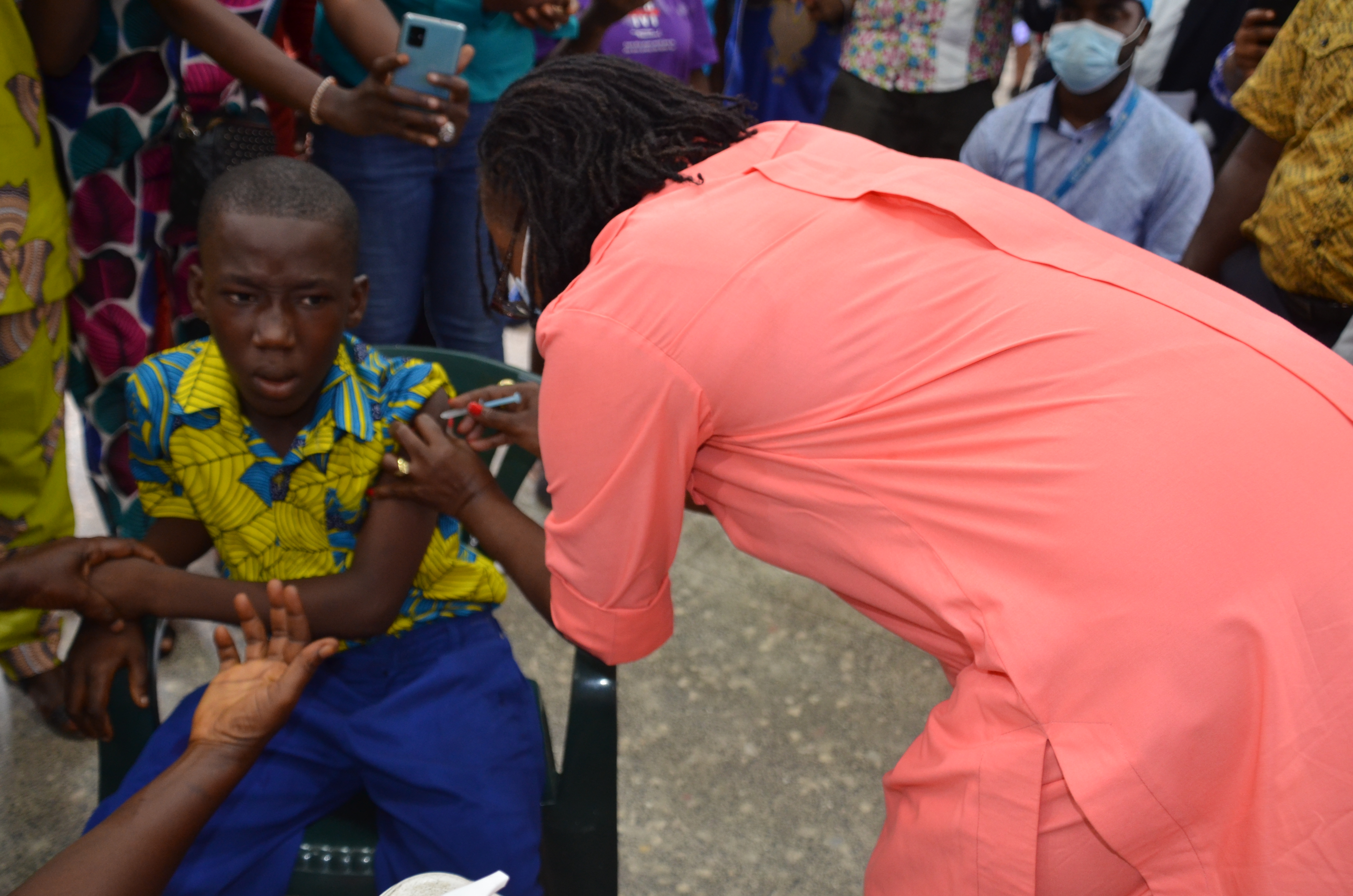 Health Minister, Dr. Wilhelmina Jallah vaccinating first kid during the TCV launch in Monrovia 
