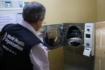 Dr. Peter Hoffman inspects autoclave at a local hospital in Monrovia