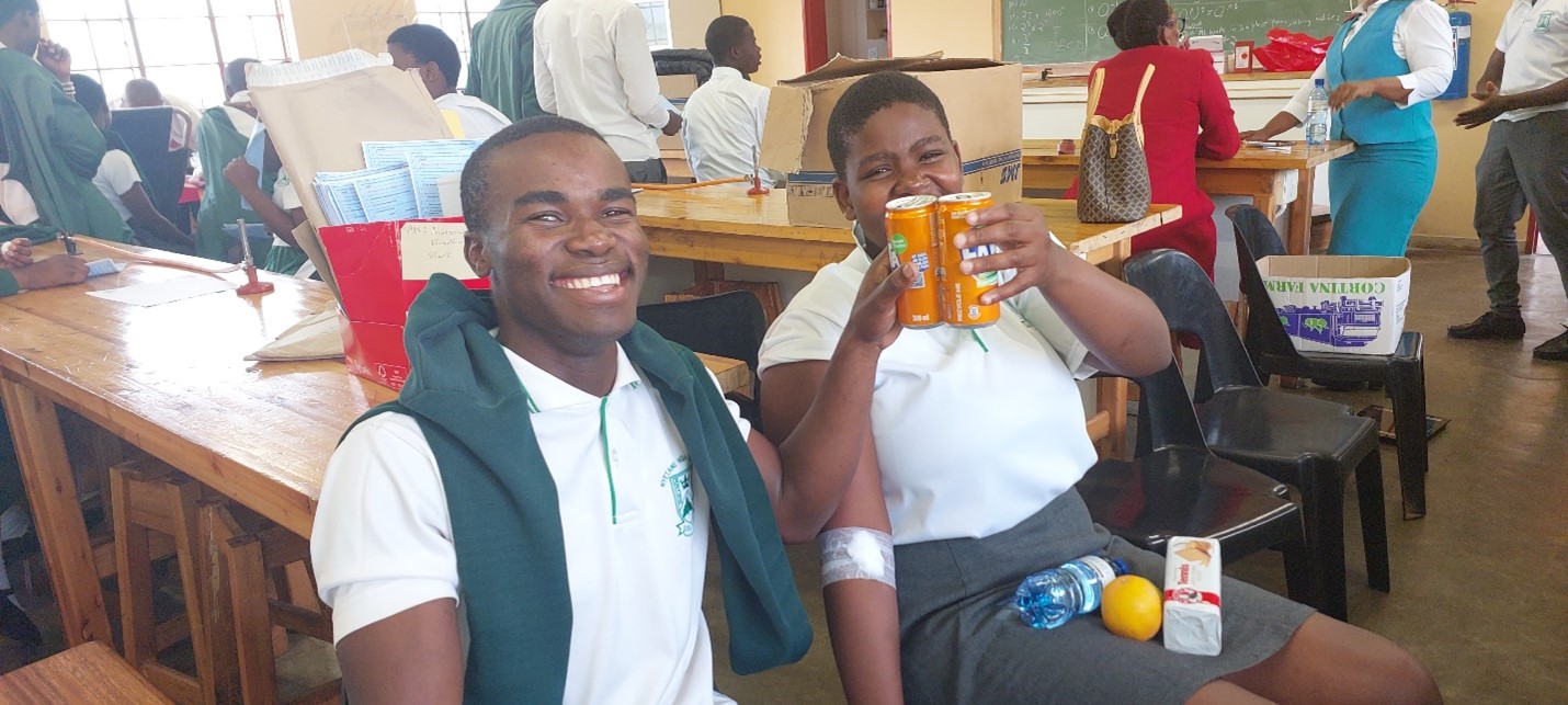Post donation care- Mlotsa poses with a friend after donating blood. 