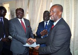 Dr. Usman presents letter of credence to the Minister of Foreign Affairs, Hon. Dr. Benjamin Barnaba while the Minister of Health applauds