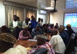 Traditional leaders in a meeting with Liberian authorities and representatives of WHO
