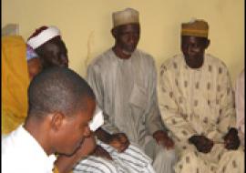 Participants in a town hall meeting discuss immunization in their community.