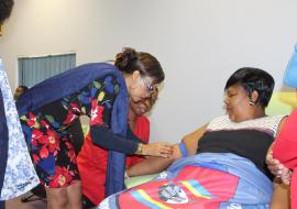 The Honourable Minister of Health, Senator Sibongile Ndlela Simelane donating blood with assisted by from the WHO Country Representative, Dr Tigest Ketsela Mengestu