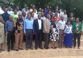 Training participants and facilitators in a group photo
