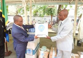 The Permanent Secretary for Health, Dr Mpoki Ulisubisya receiving the items from the WHO Representative, Dr. Adiele Onyeze
