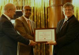 Dr Rudi Eggers, right, WHO Kenya Representative and Dr Werner Schultink, UNICEF Representative, hand over the MNTE certificate to Dr Rashid Aman, Chief Administration Secretary, MOH, Kenya