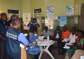 Dr Moeti (WHO Branded Jacket) observes immunization at Bwera Hopsital, Kasese district