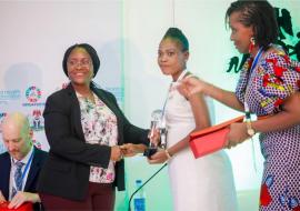 Ms. Oninye Iromba receiving an award at the NMSAP launch