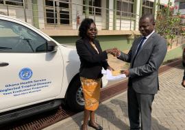 Dr Neena Kimambo, presenting the keys to the Toyota Hilux to the Dr Patrick Aboagye