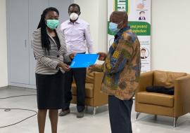 Acting WR, Dr Neema Rusibamayila Kimambo, handing over the official letter to the Minister of Health, Hon. Kwaku Agyemang-Manu