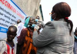 Hon. Elizabeth Acuei Yol, Minister of Health, administaring oral cholera vaccine