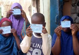 Children showing their OCV cards.jpg