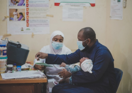Mr Aliyu Bello and his daughter to receive the routine Immunization 