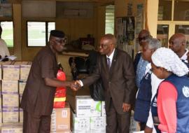 The WHO Country Representative, Dr Mulombo handing over donated items to Ondo state Commissioner for health Dr Ajaka.jpg