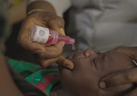 A child recieving the rotavirus vaccine at a health centre in Abuja