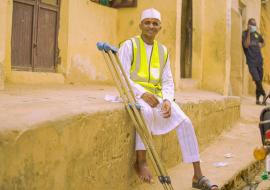 A polio survivor, Ibrahim Mohammed in the field mobilizing support for polio vaccination