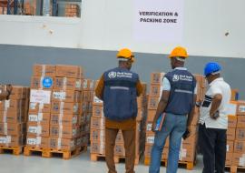 WHO Liberia staff inspecting consignment together with Central Medical Stores staff