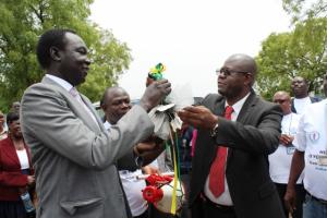 Dr. Manzila, WHO Representative to South Sudan hands the bunch of keys for the ambulances to Dr. Makur Matur Kariom, Undersecretary in the Ministry of Health