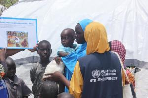 Mobile health team sensitizing   family members on cholera prevention methods. Photocredit: WHO/CE.Onuekwe