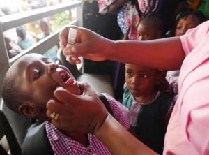 A child being vaccinated against polio in Freetown on day one of the four days campaign