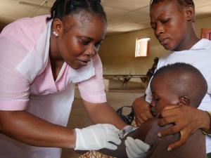 A nurse vaccinating a child