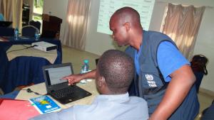 Dr Wamala Joseph helping the participants during the practical session on editing and deleting reports