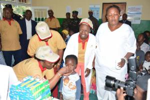 Launching of MCH Week, Minister of Health, Dr Diane Gashumba administering a deworming tablet to a child