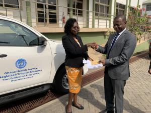 Dr Neena Kimambo, presenting the keys to the Toyota Hilux to the Dr Patrick Aboagye