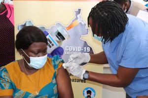 A health worker being vaccinated against COVID-19