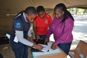 Josephine Poniso and colleagues in the triage tent at the entrance of the hospital