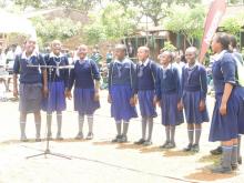 School children participate with a song at UN GRS week 2015