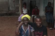 First patient discharge from the Ebola Treatment centre posing with husband