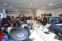 Journalists listening to Dr Alemu's speech during the briefing.