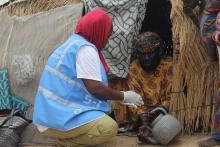 Field volunteer conducting orientation on hand washing/household hygiene. WHO/CE.Onuekwe