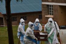 The burial team carrying the body of the second confirmed case for burial in Kween district, eastern Uganda