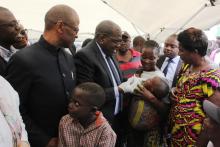 Minister of Health, Hon. Chitalu Chilufya providing a cholera vaccine to a child at the launch of the OCV campaign in Lusaka