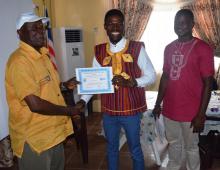 Trained water safety technician receives certificate after the validation workshop  of the Water Safety Plan validation in Buchanan, Grand Bassa County