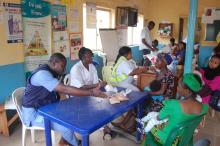Mothers bring their infants for for RI at Dutse Alhaji PHC, Abuja
