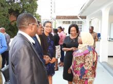 Meeting participants conversing with the Permanent Secretary and WHO Representative