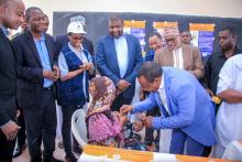 Honorable Othman Masoud, the First Vice President of Zanzibar, giving polio vaccine drops