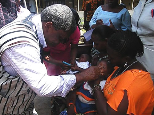 01 The Minister administering first dose of the vaccine