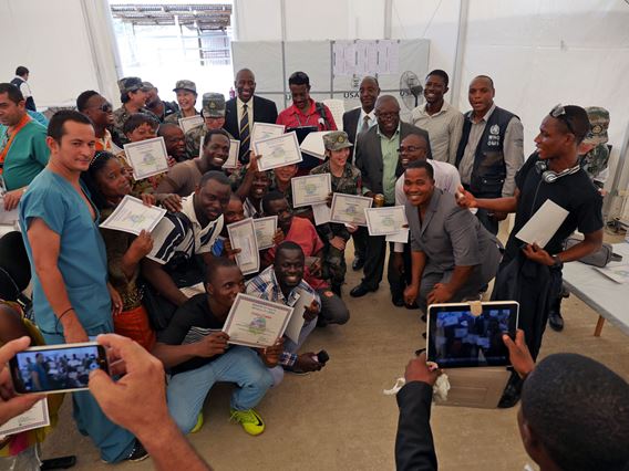 Group of graduates with their certificates from the Ministry of Health and Social Welfare.