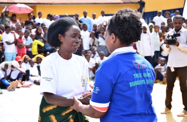 Rwanda Biomedical Centre Director General, Dr. Jeanine Condo congratulating a former TB patient after testimony