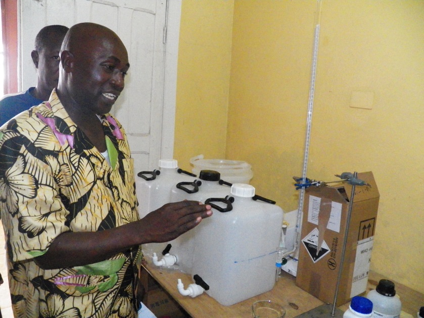 A pharmacy chemist at Bomi Hospital explaining the production process of the alcohol Based Handrub