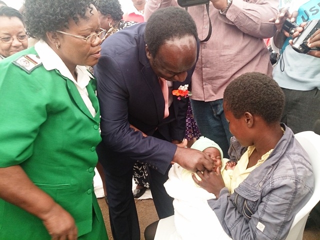 Dr Okello administering vaccine at launch