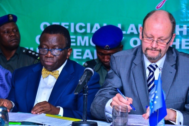 Nigerias Minister of Health (left) and EU Ambassador signing the documents for the 70 million euros grant