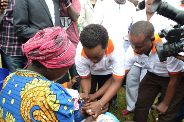 The Minister of Gender and Family Promotion, Dr Diane Gashumba, vaccinating against pneumonia at the launching of MCH week