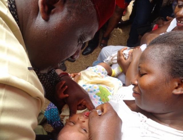 HE Governor Rochas Okorocha of Imo State vaccinating a child