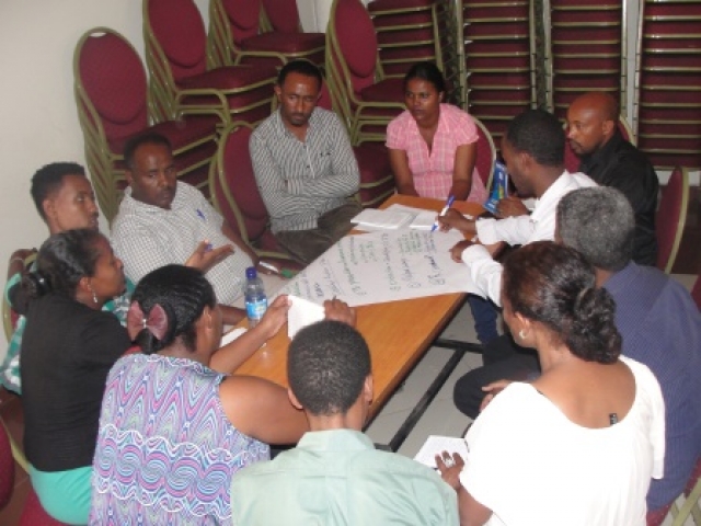 Participants engage in group work during the ENGAGE-TB sensitization workshop.